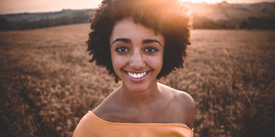 woman with a healthy and white smile, she knows about oral health