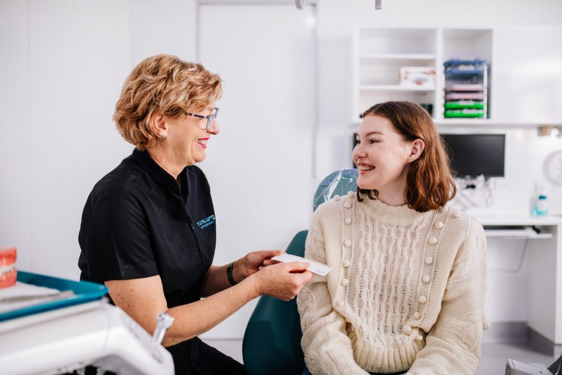 whitening treatment specialist describing how whitening treatment works Brisbane